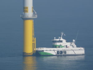 WAVECRAFT Umoe Firmus fast crew transfer vessel accessing an offshore wind turbine